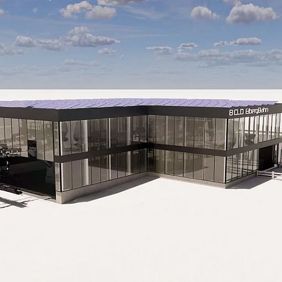 Visualiserung der neuen 8er Eibergbahn Talstation mit Glasfassade und Solardach im Skigebiet, in winterlicher Landschaft.